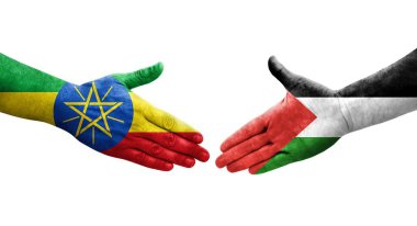 Filistin ve Etiyopya bayrakları arasındaki el sıkışma ellerinde izole şeffaf görüntü.