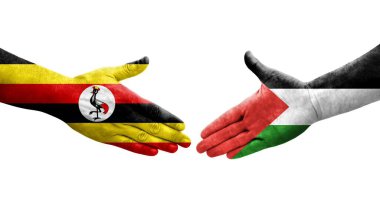 Filistin ve Uganda bayrakları arasındaki el sıkışma, izole şeffaf görüntü.