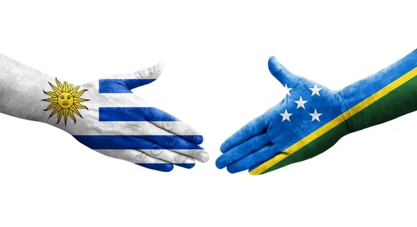 Händedruck Zwischen Salomonen Und Uruguay Flaggen Auf Hände Gemalt Isoliertes — Stockfoto