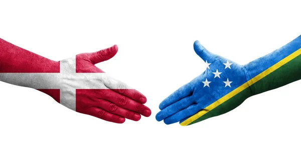 所罗门群岛和丹麦国旗之间的握手 孤立透明的图像 — 图库照片