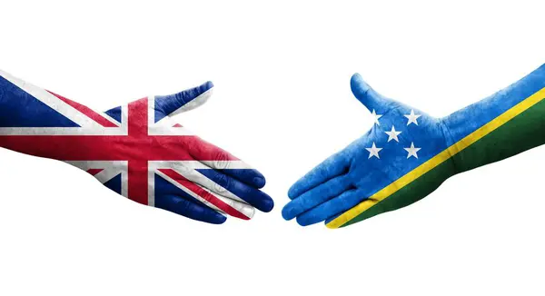 Handdruk Tussen Salomonseilanden Het Verenigd Koninkrijk Vlaggen Geschilderd Handen Geïsoleerd — Stockfoto