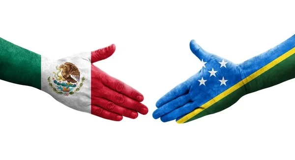 ソロモン諸島とメキシコの旗の間の握手手で描かれ 孤立した透明なイメージ — ストック写真