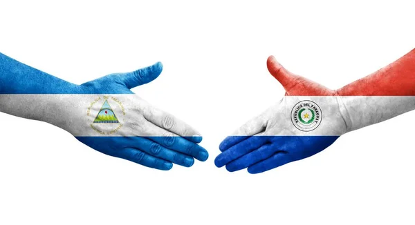 Handshake Entre Paraguai Nicarágua Bandeiras Pintadas Mãos Imagem Transparente Isolada — Fotografia de Stock