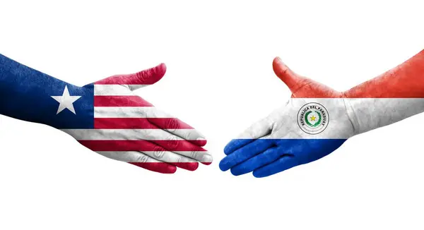 Händedruck Zwischen Flaggen Paraguays Und Liberias Auf Hände Gemalt Isoliertes — Stockfoto