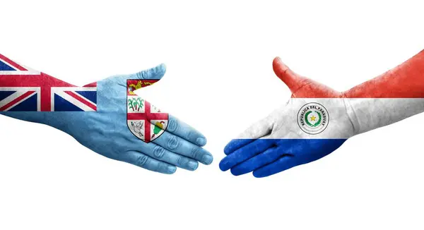 stock image Handshake between Paraguay and Fiji flags painted on hands, isolated transparent image.