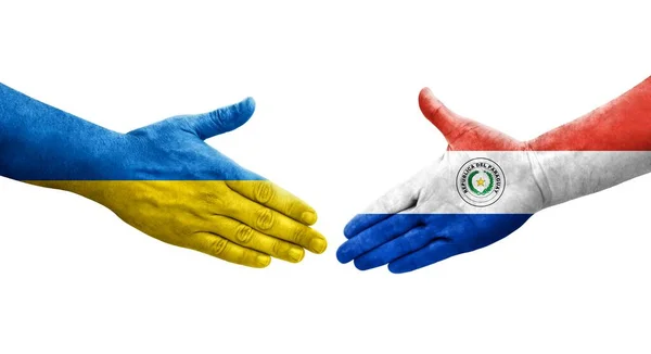 stock image Handshake between Paraguay and Ukraine flags painted on hands, isolated transparent image.