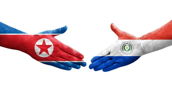 Aperto Mão Entre Paraguai Coreia Norte Bandeiras Pintadas Mãos Imagem — Fotografia de Stock