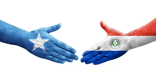 Handshake Entre Paraguai Somália Bandeiras Pintadas Mãos Imagem Transparente Isolada — Fotografia de Stock