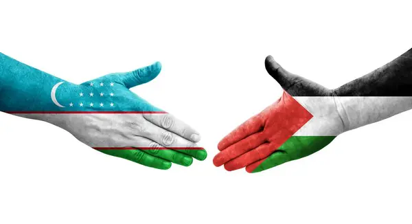 Aperto Mão Entre Palestina Usbequistão Bandeiras Pintadas Mãos Imagem Transparente — Fotografia de Stock