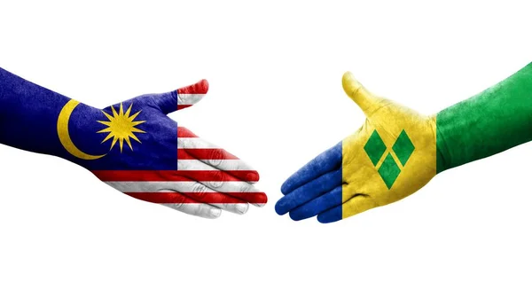 Рукопожатие Между Сент Винсент Гренадины Флаги Малайзии Нарисованные Руках Изолированное — стоковое фото