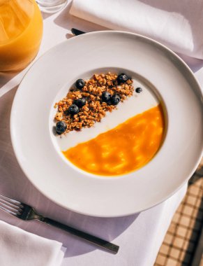 Top view of fruits smoothie bowl with oat and blueberry