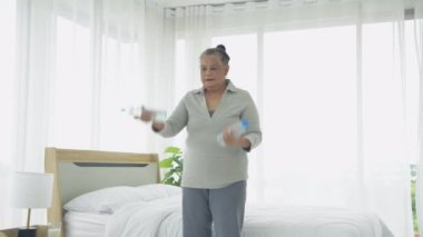 Exercise concept of 4k Resolution. Asian elderly woman exercising at home.
