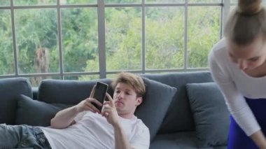 Family concept of 4k Resolution. Caucasian couple cleaning in the house. taking advantage.