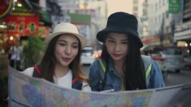 Travel concept of 4k Resolution. Asian women are using maps to find places together in the city.
