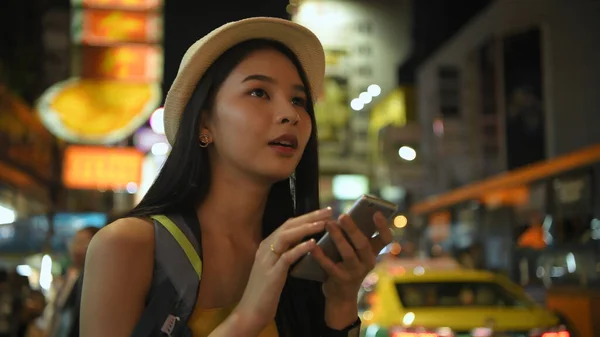 Travel Concept Resolution Asian Woman Using Phone Road While Traveling Stok Gambar Bebas Royalti
