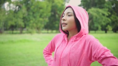 Exercise concept of 4k Resolution. Caucasian woman resting after exercising in the park.