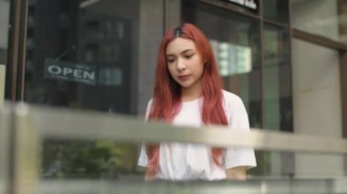 Holiday concept of 4k Resolution. Caucasian woman walking in the city. hip hop teenage fashion.