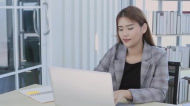 Business concept of 4k Resolution. Asian woman working using laptop in office.