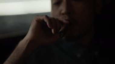 Night club concept of 4k Resolution. Asian man smoking cigar in restaurant. A group of specialized clubs that sell alcoholic beverages.