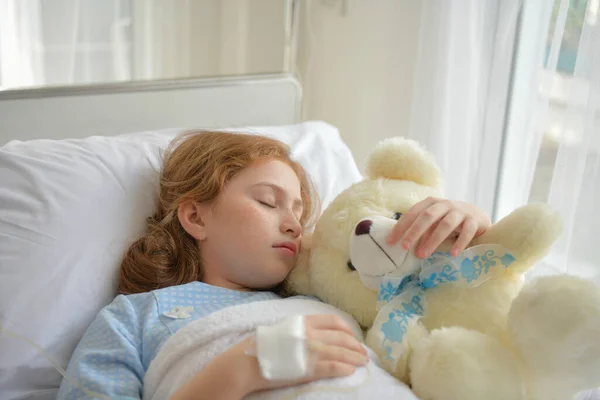 stock image Caucasian girl sleeping in hospital. She is recovering from an illness.