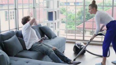 Family concept of 4k Resolution. Caucasian couple cleaning in the house. taking advantage.