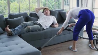 Family concept of 4k Resolution. Caucasian couple cleaning in the house. taking advantage.