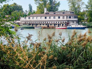 Houseboat on the Danube River, boats moored alongside