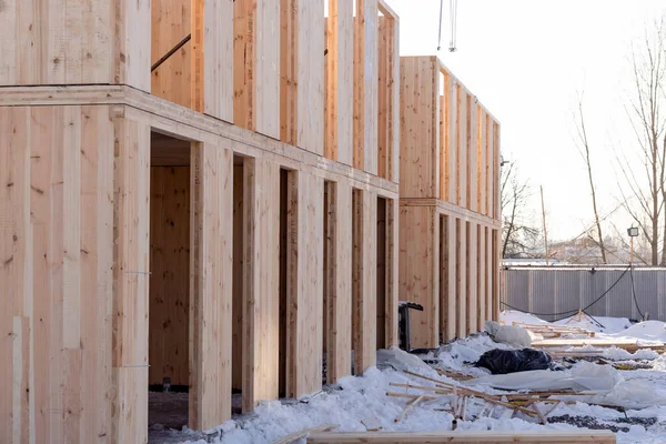 The process of building a new modern modular house from composite sip panels in winter. High quality photo