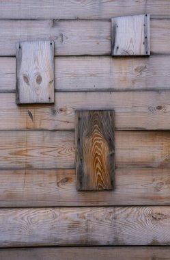 Old wooden boards with knots and scratches, wood texture for background.
