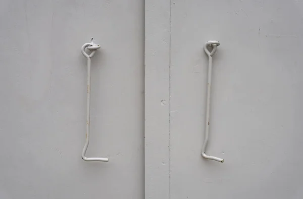 Door metal bent hooks on iron doors for fixing in open position