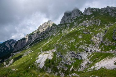Mala Spice Cime Verdi peaks on Mangart saddle, Slovenia's Highest Panoramic Road, heavy clouds before summer rain