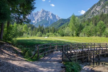 Scenery lake called Jasna in European Slovenian Julian Alps, beautiful water surface with reflections near the road to Vrsic Pass