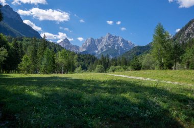 Scenery lake called Jasna in European Slovenian Julian Alps, beautiful water surface with reflections near the road to Vrsic Pass