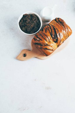 Traditional Romanian sweet bread cozonac with ingredients on table. Easter baking sourdough. Healthy food. top view. space for text. High quality photo