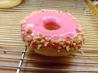 Pink donut in oven