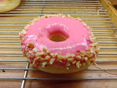 Pink donut in oven