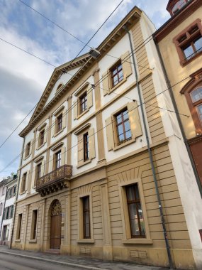 Low Angle Historic European Building Yellow Shutters