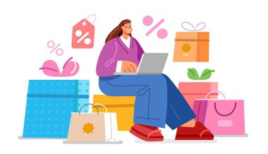 Alışveriş torbaları ve kutular. E-ticaret konsepti. Genç, mutlu bir kadın internetten alışveriş için dizüstü bilgisayar kullanıyor.