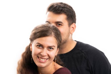 Happy cute female model smiling with boyfriend hugging wearing casual fall attire as romantic love concept isolated on white studio background