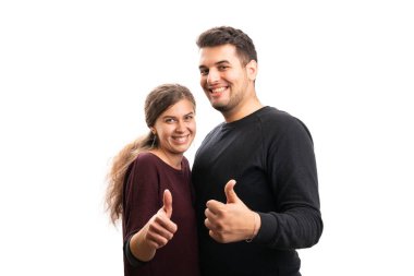 Cheerful boyfriend and girlfriend making thumb-up like gesture  with blank copyspace isolated on white studio background