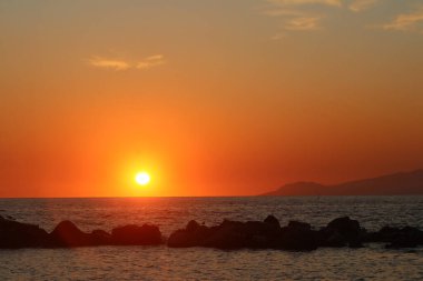 A romantic sunset over Mediterranean Sea near Naples, Italy