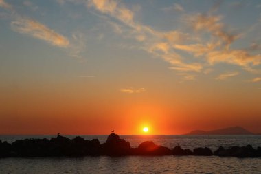 A romantic sunset over Mediterranean Sea near Naples, Italy
