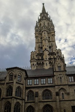 The New Town Hall, an architectural masterpiece, dominates the Munich skyline. Its neo-Gothic style is a testament to the city's rich history and artistic heritage. Details and a towering tower. clipart