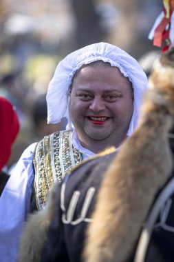 Sofia, Bulgaria - January 08, 2023: Unidentified man in traditional kuker costume at the Surva masquerade games festival in Sofia, Bulgaria. Kuker costume at the masquerade games in Sofia, Bulgaria