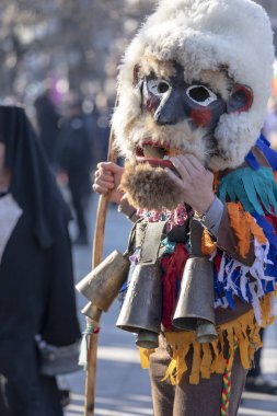 Sofia, Bulgaria - January 08, 2023: Unidentified man in traditional kuker costume at the Surva masquerade games festival in Sofia, Bulgaria. Kuker costume at the masquerade games in Sofia, Bulgaria