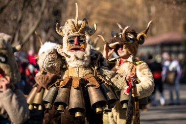 Sofia, Bulgaria - January 08, 2023: Unidentified man in traditional kuker costume at the Surva masquerade games festival in Sofia, Bulgaria. Kuker costume at the masquerade games in Sofia, Bulgaria