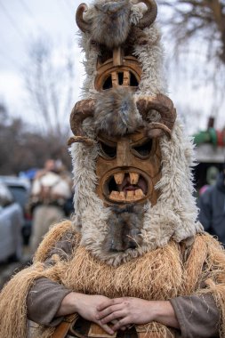 Breznik, Bulgaria - January 21, 2023: Masquerade festival in Breznik Bulgaria. People with a mask called Kukeri dance and perform to scare the evil spirits. The photo was taken on January 21th, 2023