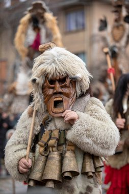 Breznik, Bulgaria - January 21, 2023: Masquerade festival in Breznik Bulgaria. People with a mask called Kukeri dance and perform to scare the evil spirits. The photo was taken on January 21th, 2023