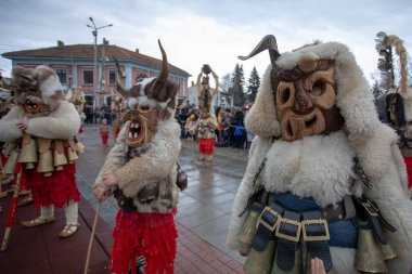 Breznik, Bulgaria - January 21, 2023: Masquerade festival in Breznik Bulgaria. People with a mask called Kukeri dance and perform to scare the evil spirits. The photo was taken on January 21th, 2023