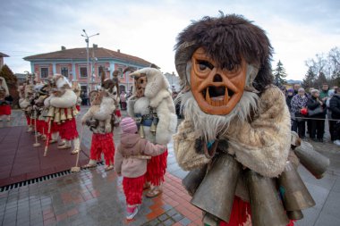 Breznik, Bulgaria - January 21, 2023: Masquerade festival in Breznik Bulgaria. People with a mask called Kukeri dance and perform to scare the evil spirits. The photo was taken on January 21th, 2023